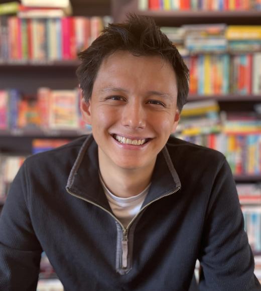 Ben Fong in front of bookcases