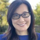 Woman in glasses and a blue shirt